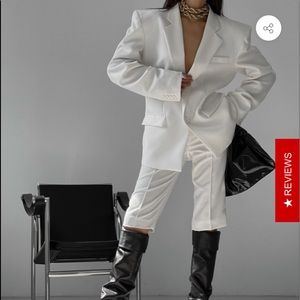 White oversized boxy blazer and short pants.